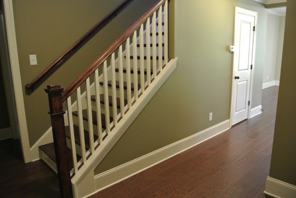 Design ideas for a mid-sized transitional hallway in Atlanta with grey walls and dark hardwood floors.