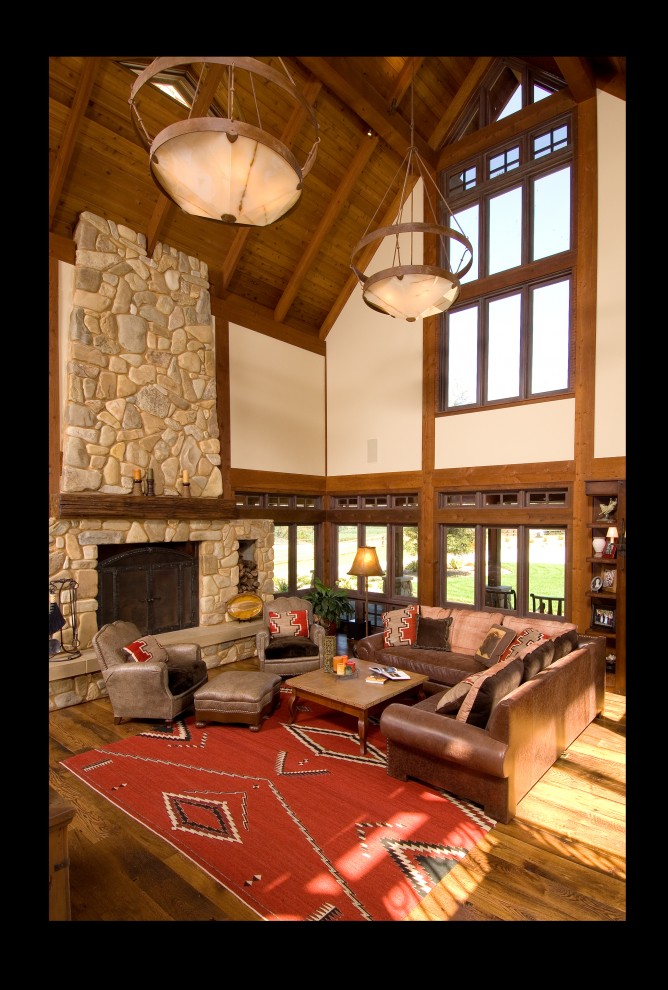 Design ideas for a country living room in DC Metro with a standard fireplace and a stone fireplace surround.
