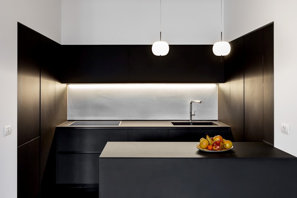 Design ideas for a contemporary u-shaped open plan kitchen in Turin with an integrated sink, beaded inset cabinets, black cabinets, quartz benchtops, white splashback, dark hardwood floors and a peninsula.