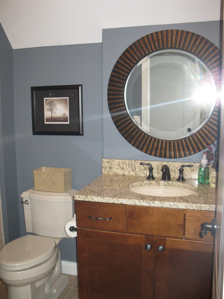 Transitional bathroom photo in Cincinnati with shaker cabinets, medium tone wood cabinets and granite countertops