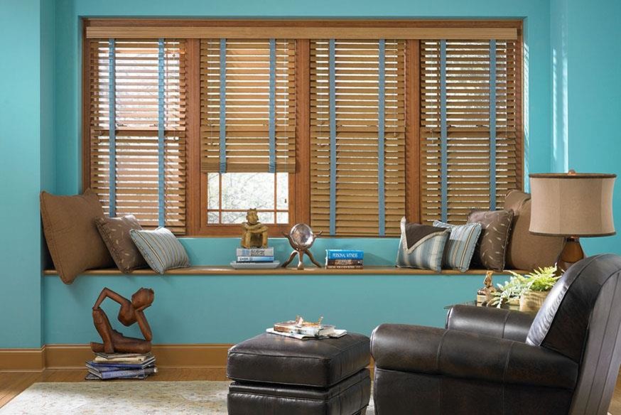 Example of a mid-sized minimalist open concept medium tone wood floor living room design in Denver with green walls