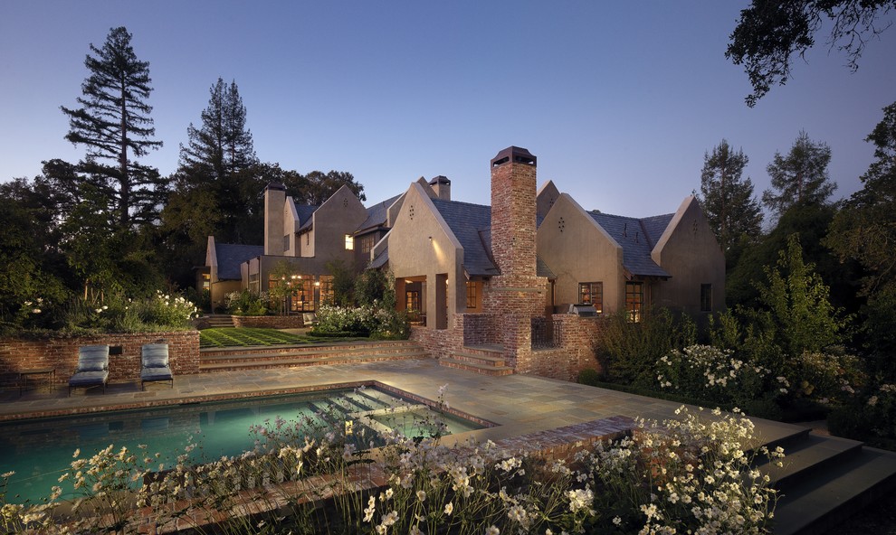 Design ideas for a traditional rectangular pool in San Francisco with natural stone pavers.