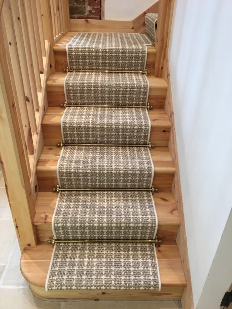 Inspiration for a mid-sized country wood u-shaped staircase in Surrey with wood risers and wood railing.