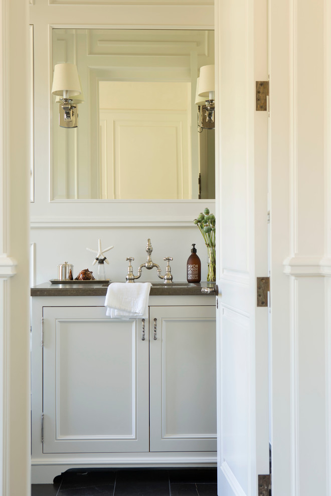 Inspiration for a traditional bathroom in Orange County with white walls and grey benchtops.