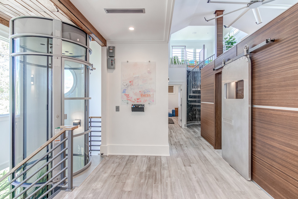 Hallway - contemporary gray floor hallway idea in Wilmington with white walls