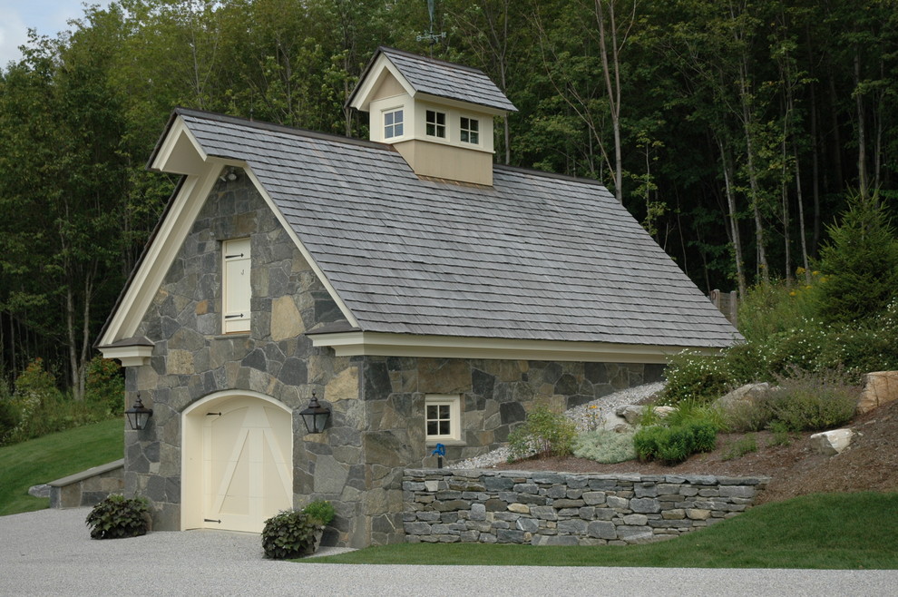 Photo of a traditional detached one-car garage in Boston.