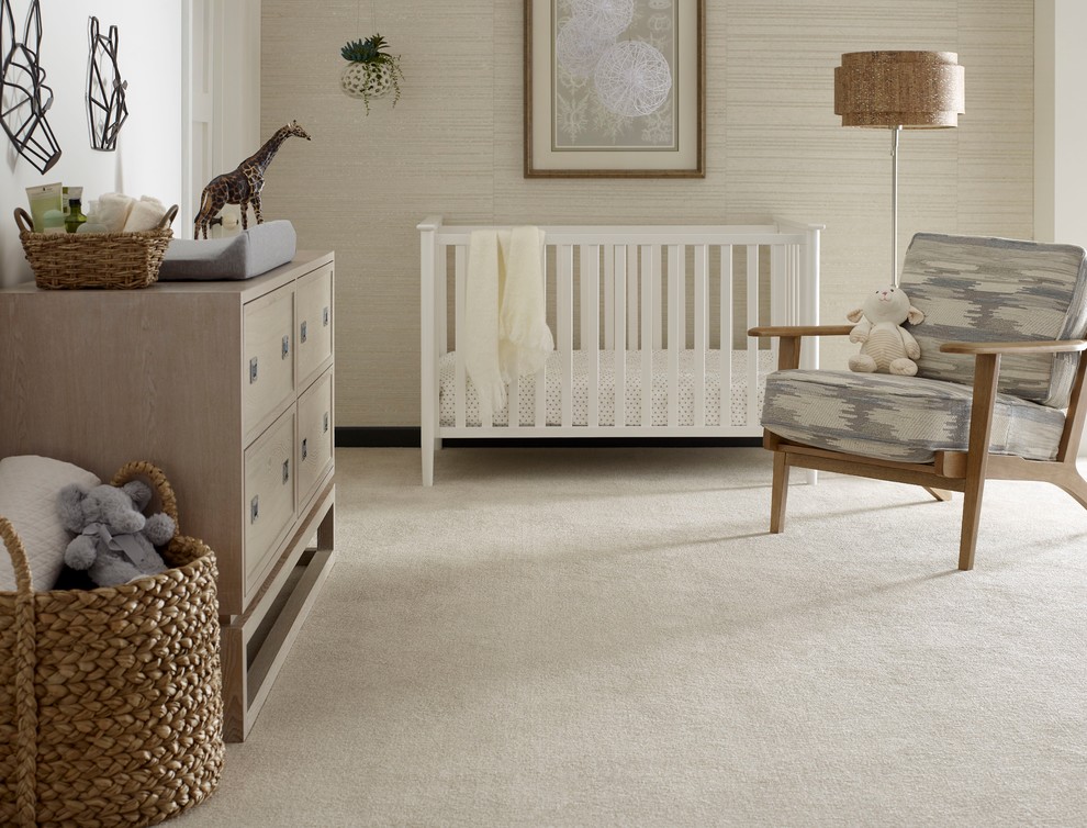 Design ideas for a mid-sized contemporary gender-neutral nursery in Dallas with beige walls, carpet and beige floor.