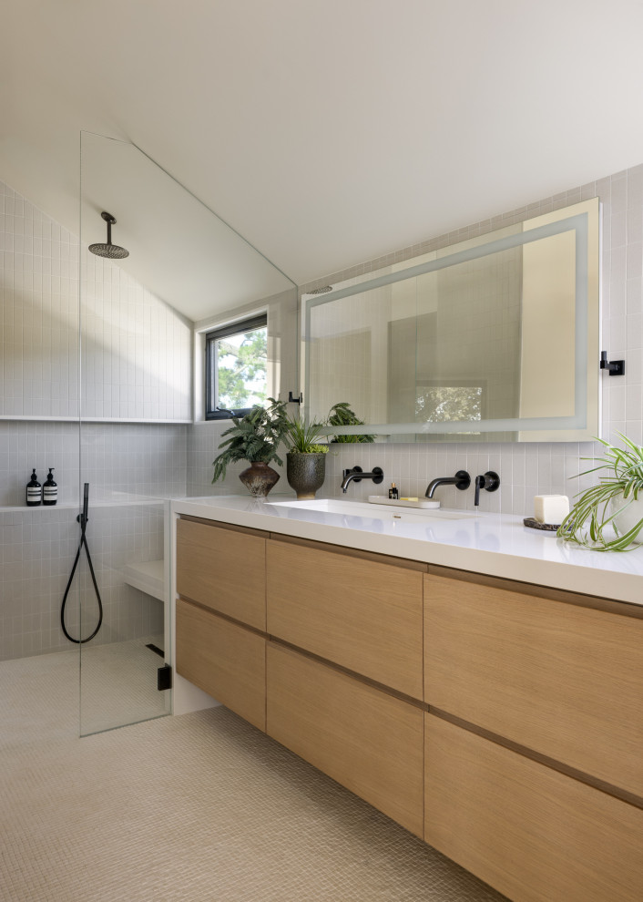 Alcove shower - modern beige floor, double-sink and vaulted ceiling alcove shower idea in San Francisco with flat-panel cabinets, medium tone wood cabinets, white walls, an undermount sink, white countertops and a floating vanity