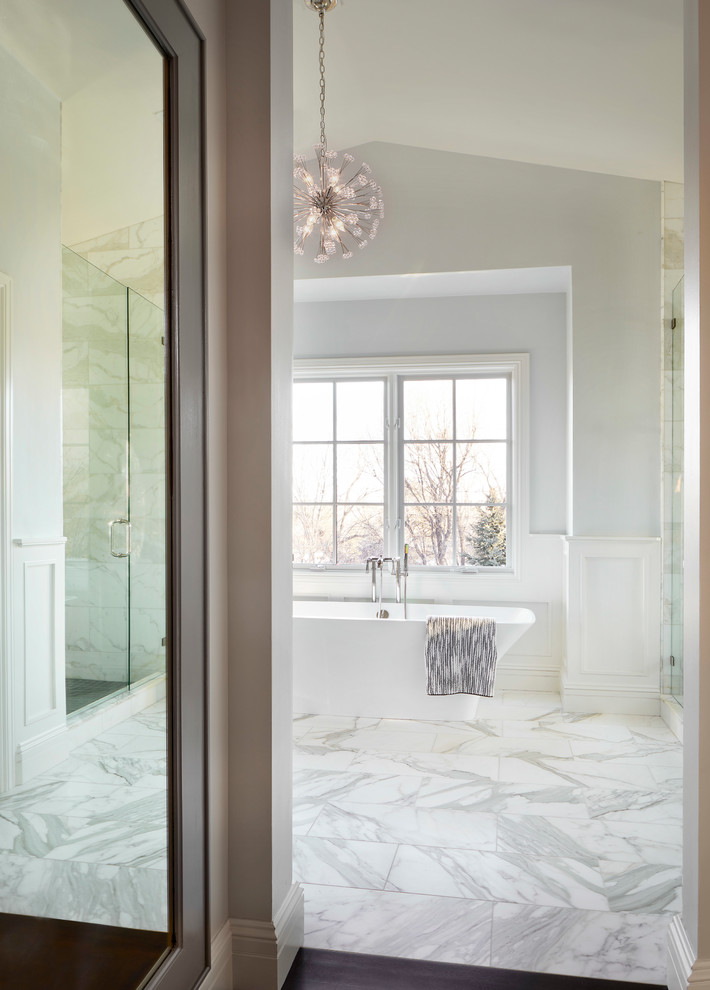 Photo of a large contemporary master bathroom in Denver with recessed-panel cabinets, grey cabinets, a freestanding tub, an alcove shower, a two-piece toilet, white tile, marble, grey walls, marble floors, an undermount sink, marble benchtops, white floor, a hinged shower door and white benchtops.