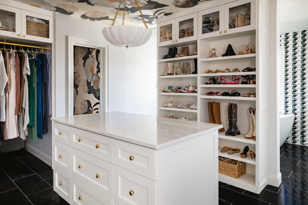 Design ideas for a mid-sized traditional walk-in wardrobe in Dallas with white cabinets, black floor and wallpaper.