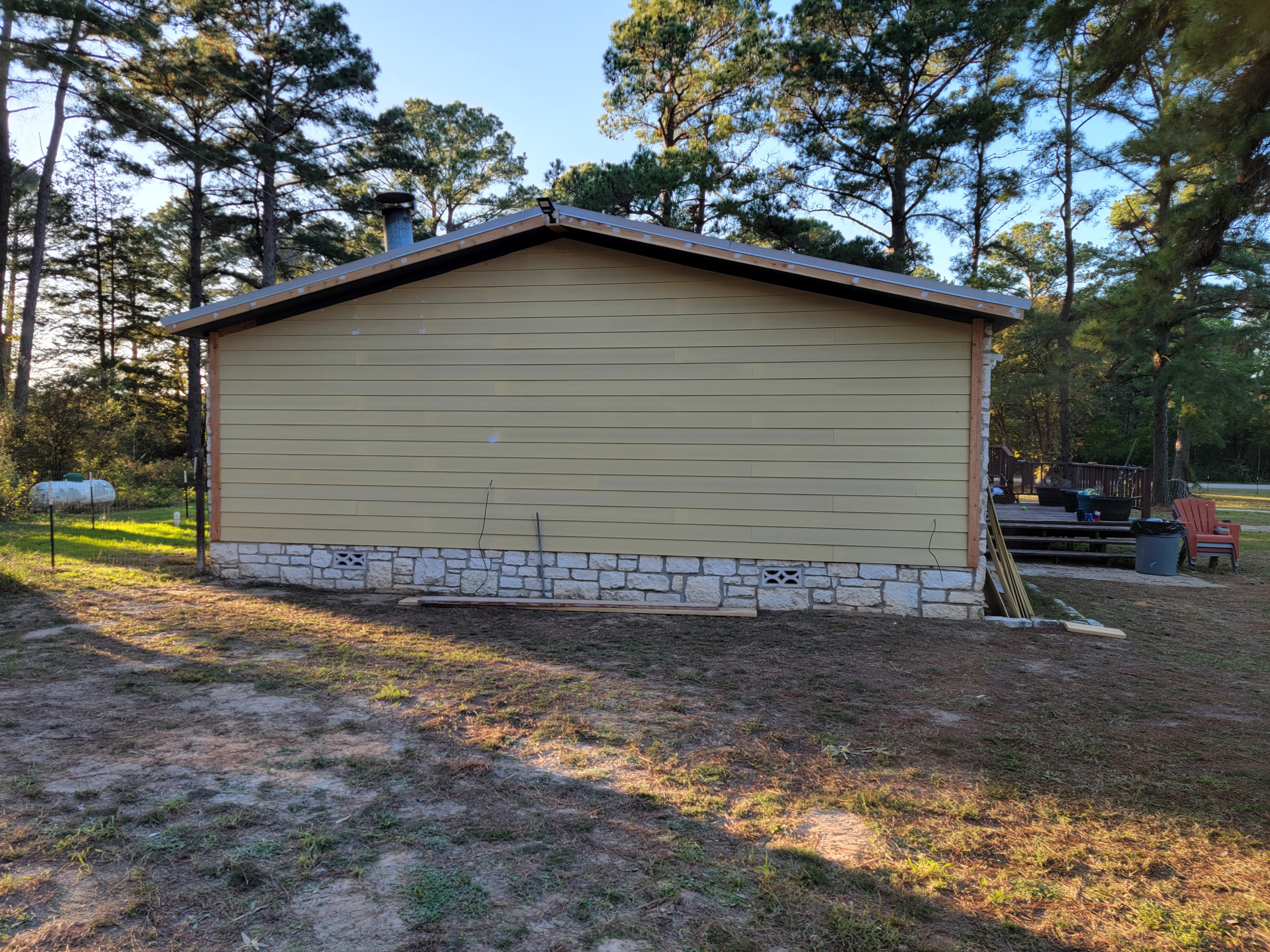 Exterior After new siding and facia and trim boards