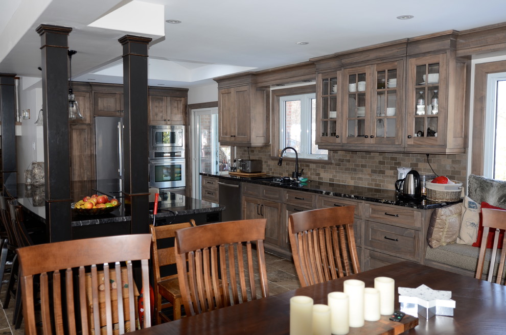 Example of a transitional home design design in Toronto
