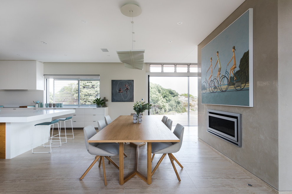 This is an example of a large contemporary kitchen/dining combo in Perth with multi-coloured walls and brown floor.
