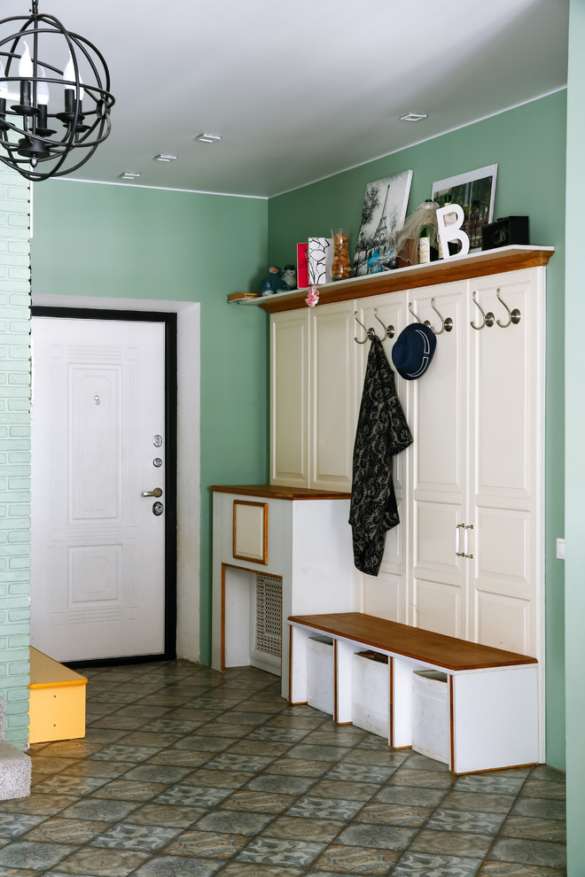 Transitional mudroom in Moscow with green walls, a single front door, a white front door and multi-coloured floor.