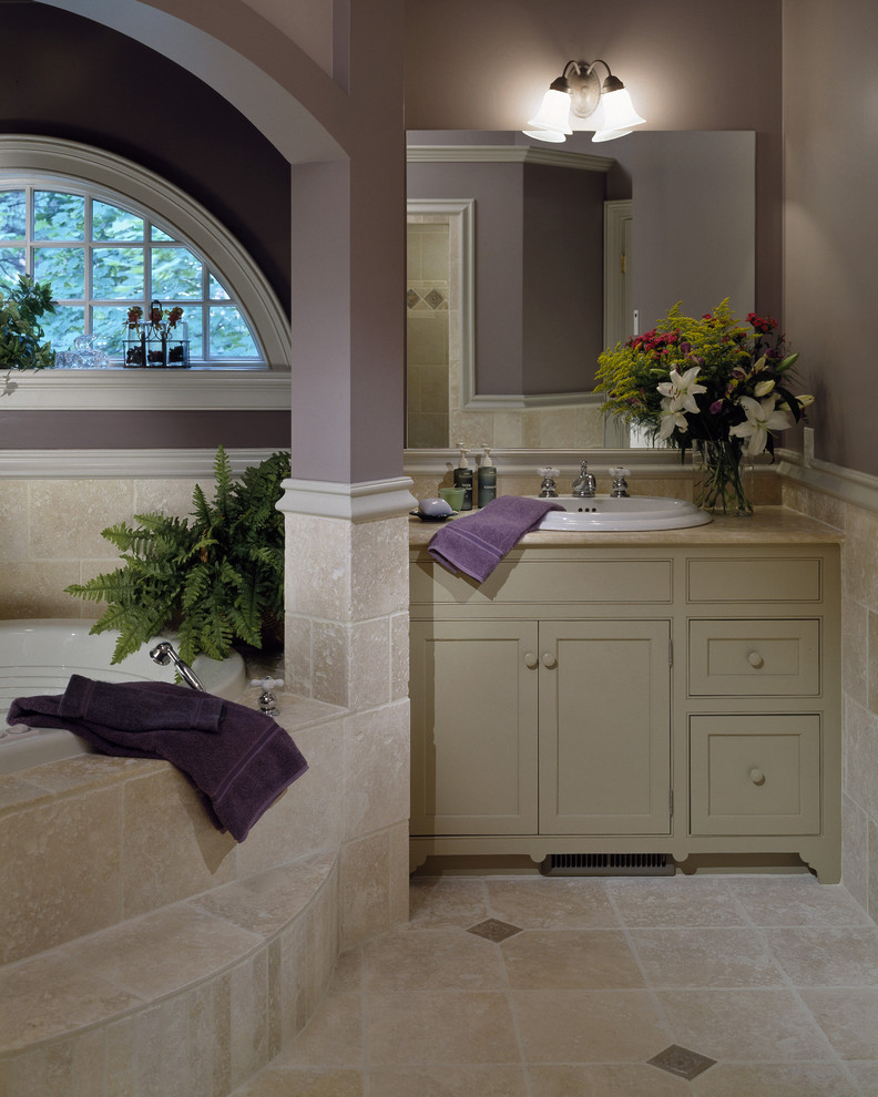 Inspiration for a traditional bathroom in New York with stone tile and beige floor.