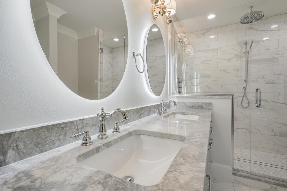 Inspiration for a large transitional master bathroom in New Orleans with flat-panel cabinets, grey cabinets, a freestanding tub, a double shower, white tile, marble, white walls, marble floors, an undermount sink, engineered quartz benchtops, white floor, a hinged shower door, grey benchtops, a shower seat, a single vanity and a built-in vanity.