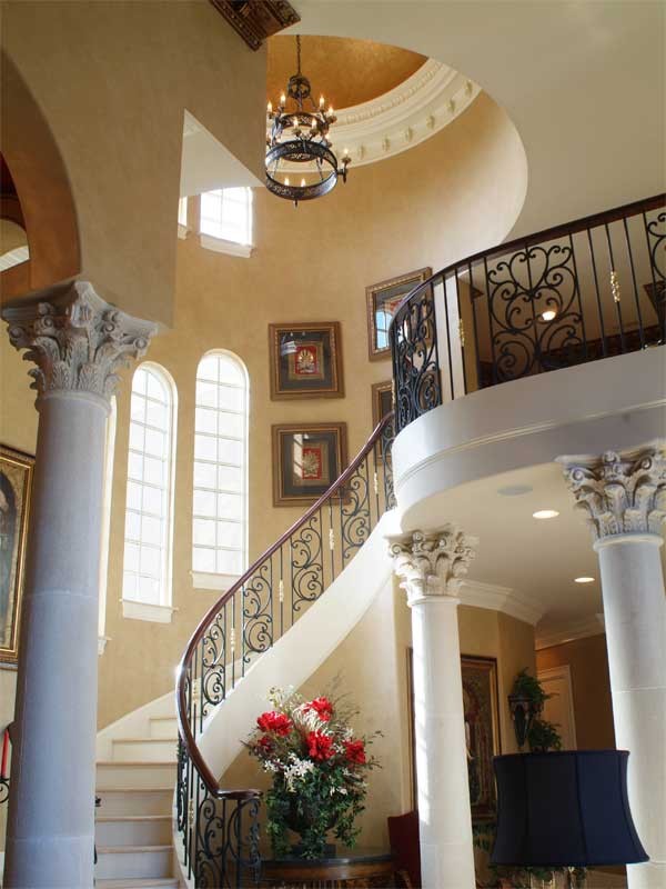 Inspiration for a mid-sized mediterranean tile curved staircase remodel in Other with painted risers