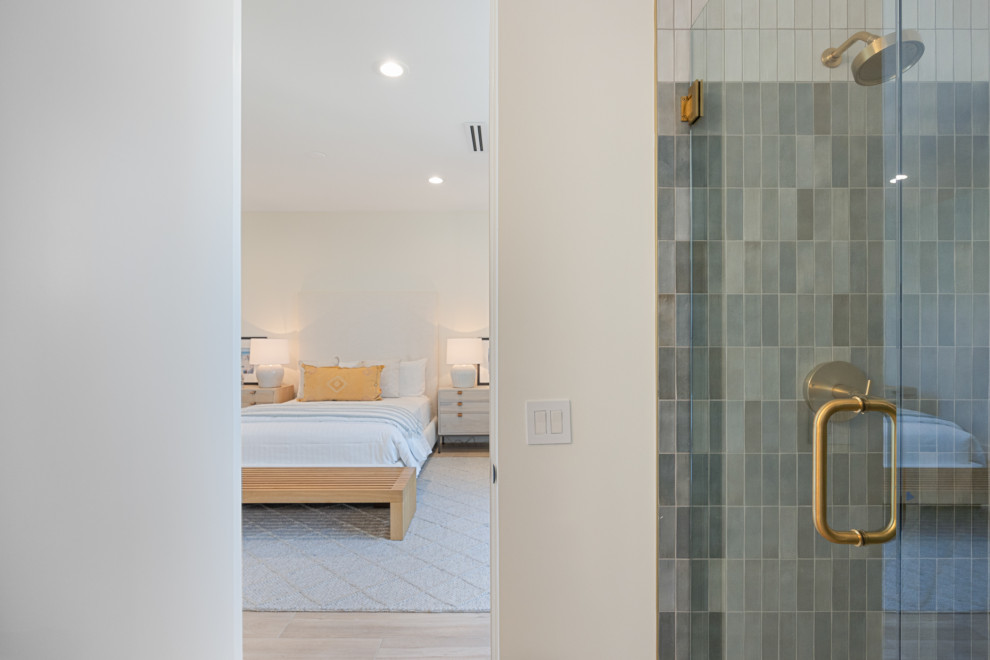 Alcove shower - small transitional kids' blue tile and ceramic tile porcelain tile, beige floor and single-sink alcove shower idea with flat-panel cabinets, medium tone wood cabinets, a one-piece toilet, white walls, an undermount sink, quartz countertops, a hinged shower door, white countertops and a floating vanity