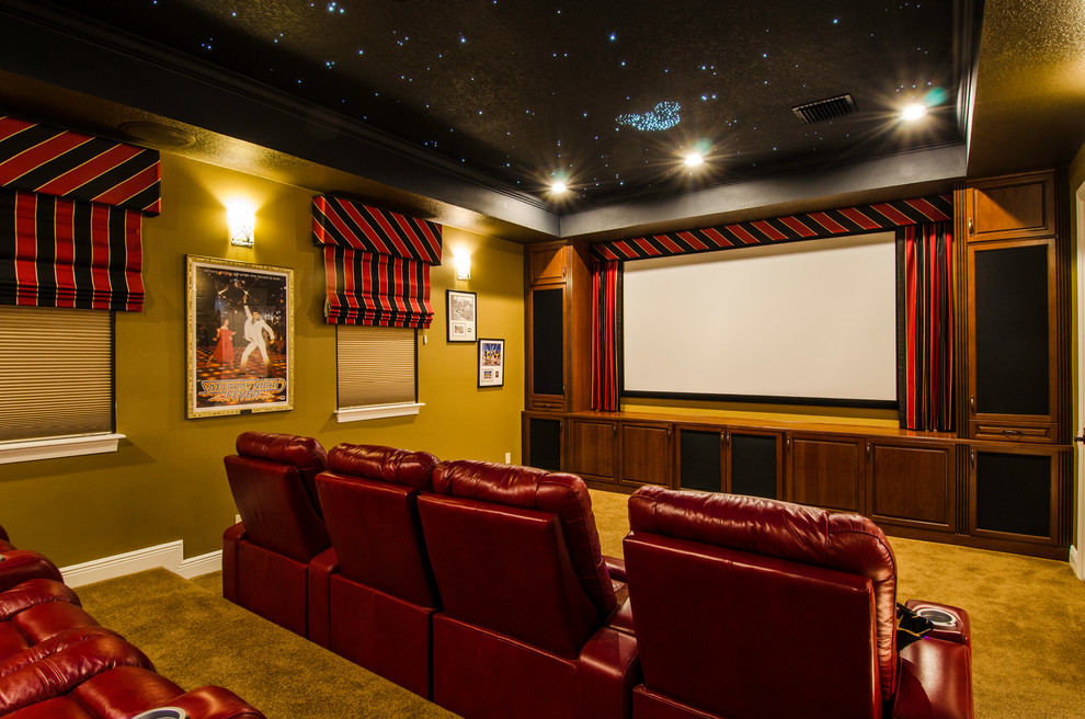 Photo of a large traditional enclosed home theatre in Tampa with a projector screen, brown walls, carpet and brown floor.