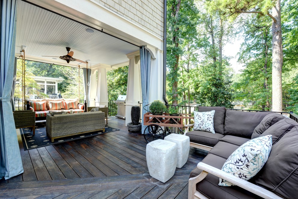 Design ideas for a large traditional backyard verandah in Atlanta with decking and a roof extension.