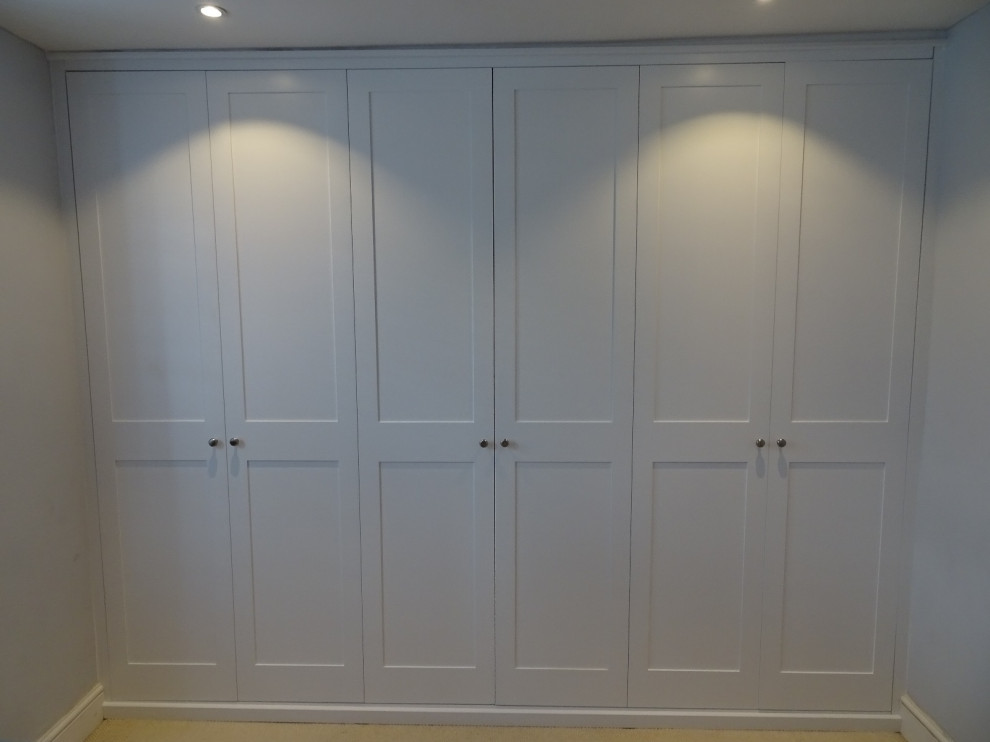 Built in bedroom paneled cupboards