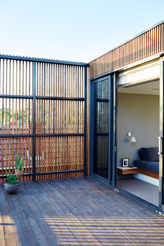 Inspiration for a contemporary verandah in Melbourne with decking.