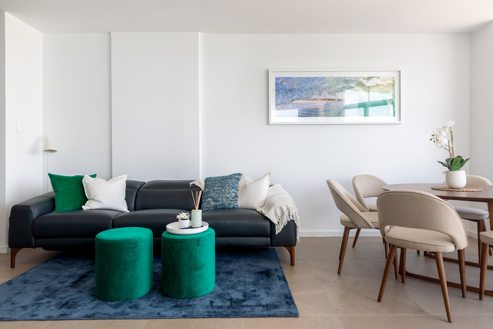 Design ideas for a beach style living room in Sydney with white walls and beige floor.
