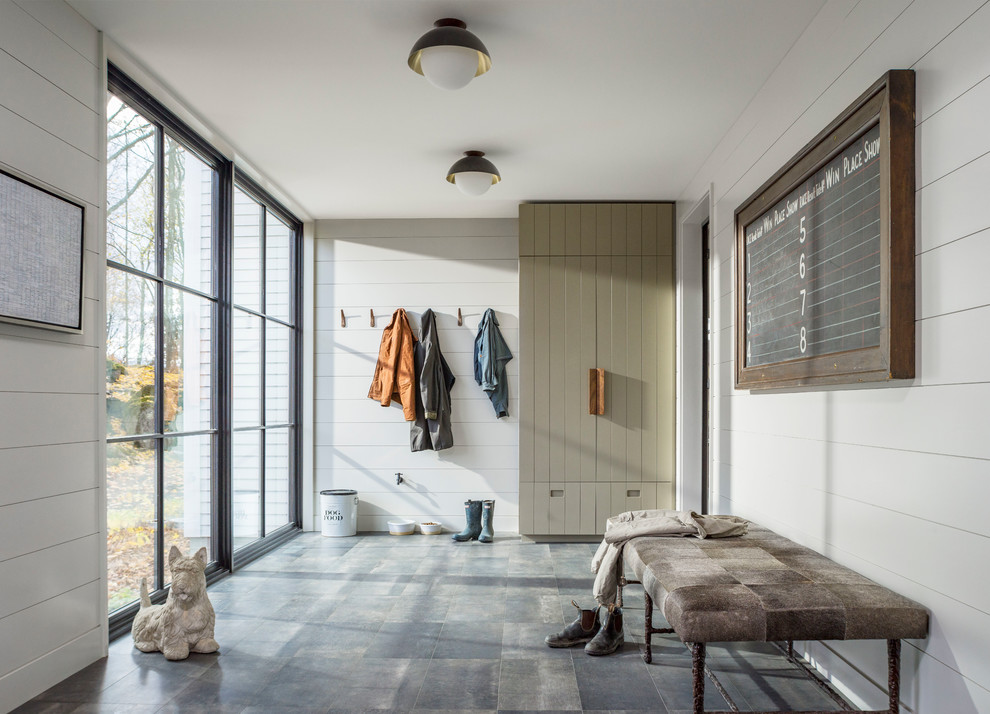 Large farmhouse porcelain tile and gray floor mudroom photo in Burlington with white walls