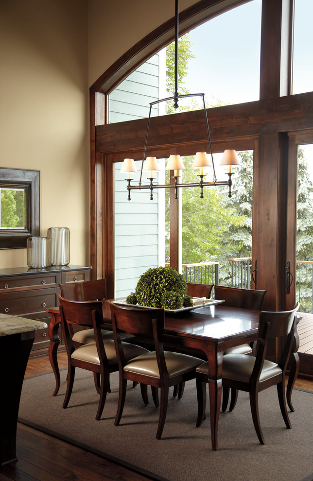 This is an example of a large transitional separate dining room in Minneapolis with beige walls, medium hardwood floors, no fireplace and brown floor.