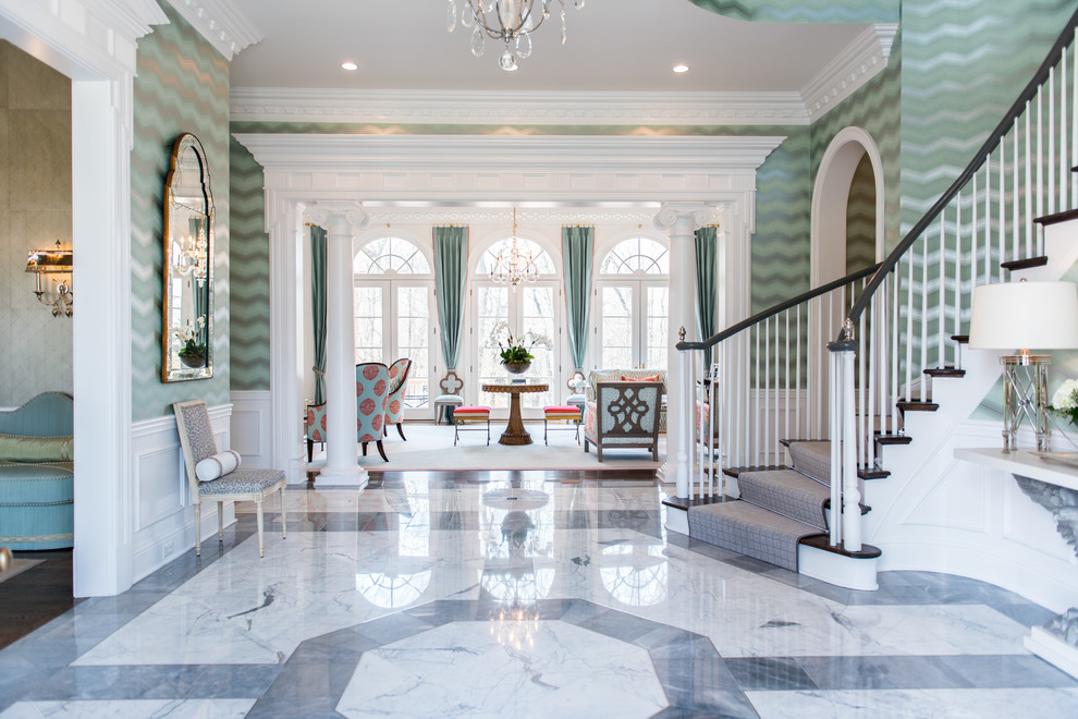 Large modern foyer in Louisville with green walls, marble floors and grey floor.