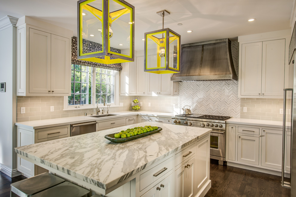 This is an example of a mid-sized transitional u-shaped eat-in kitchen in San Francisco with an undermount sink, recessed-panel cabinets, white cabinets, marble benchtops, beige splashback, ceramic splashback and dark hardwood floors.
