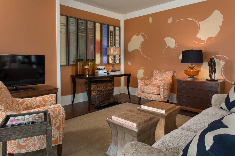 Photo of a mid-sized transitional loft-style family room in New York with orange walls, medium hardwood floors and a freestanding tv.