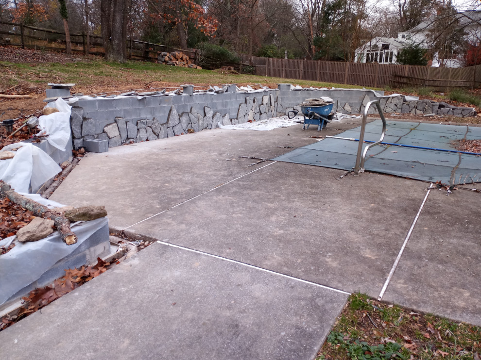 STONE FIREPLACE  , BBQ GRILL   AND STONE RETAINING WALL