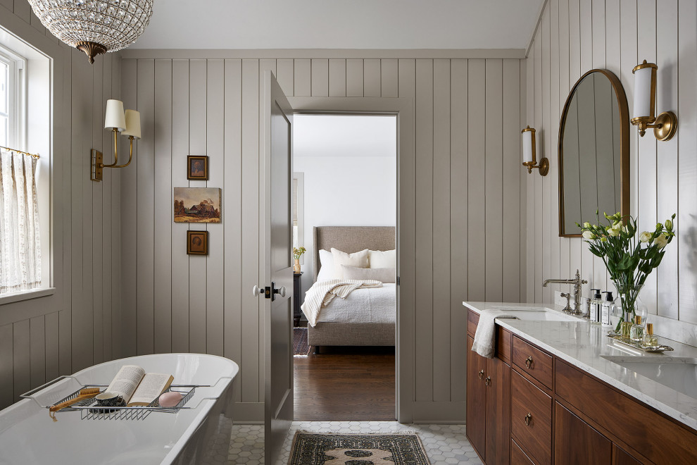 Bathroom - large farmhouse master marble floor, gray floor, double-sink, exposed beam and wall paneling bathroom idea in Chicago with flat-panel cabinets, medium tone wood cabinets, a two-piece toilet, gray walls, an undermount sink, marble countertops, a hinged shower door, gray countertops and a freestanding vanity