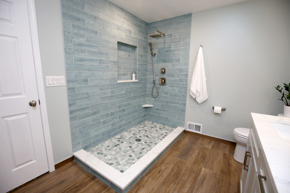 Photo of a mid-sized modern master bathroom in Denver with raised-panel cabinets, grey cabinets, green tile, ceramic tile, grey walls, an undermount sink, marble benchtops, brown floor, white benchtops and a double vanity.