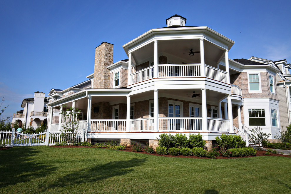 Home design - transitional two-story wood gray home design idea in Louisville with a hip roof