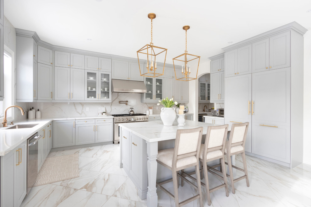 Inspiration for an expansive transitional l-shaped kitchen pantry in DC Metro with flat-panel cabinets, medium wood cabinets, granite benchtops, white splashback, with island, multi-coloured floor and blue benchtop.