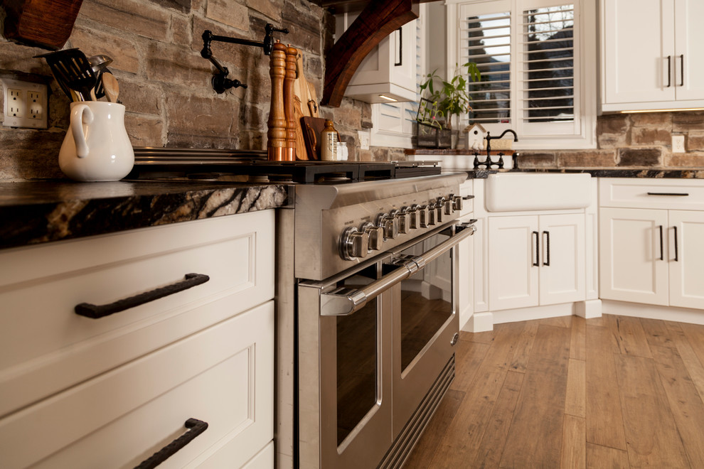 Example of a transitional kitchen design in Toronto