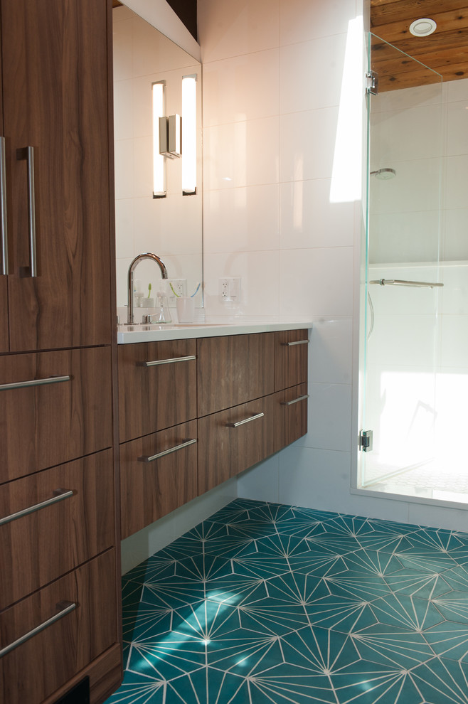 Inspiration for a midcentury master bathroom in Wilmington with flat-panel cabinets, white tile, cement tiles, an undermount sink, engineered quartz benchtops, turquoise floor, a hinged shower door and white walls.