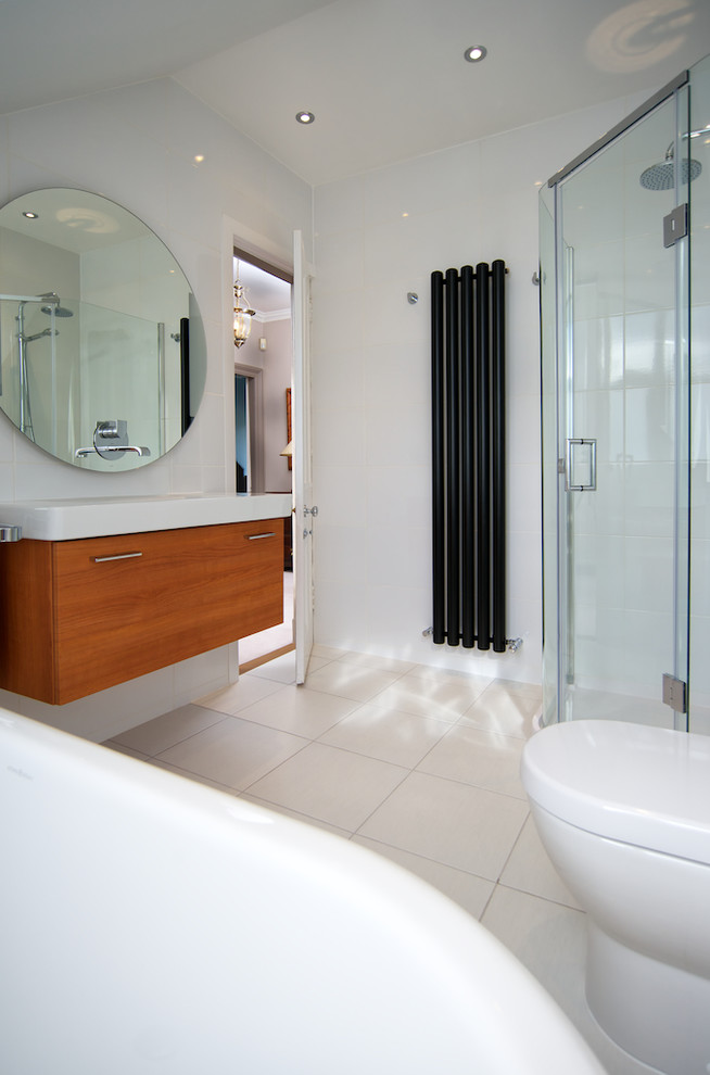 Mid-sized contemporary master bathroom in Other with a console sink, flat-panel cabinets, medium wood cabinets, granite benchtops, a corner shower, a two-piece toilet, white walls and ceramic floors.