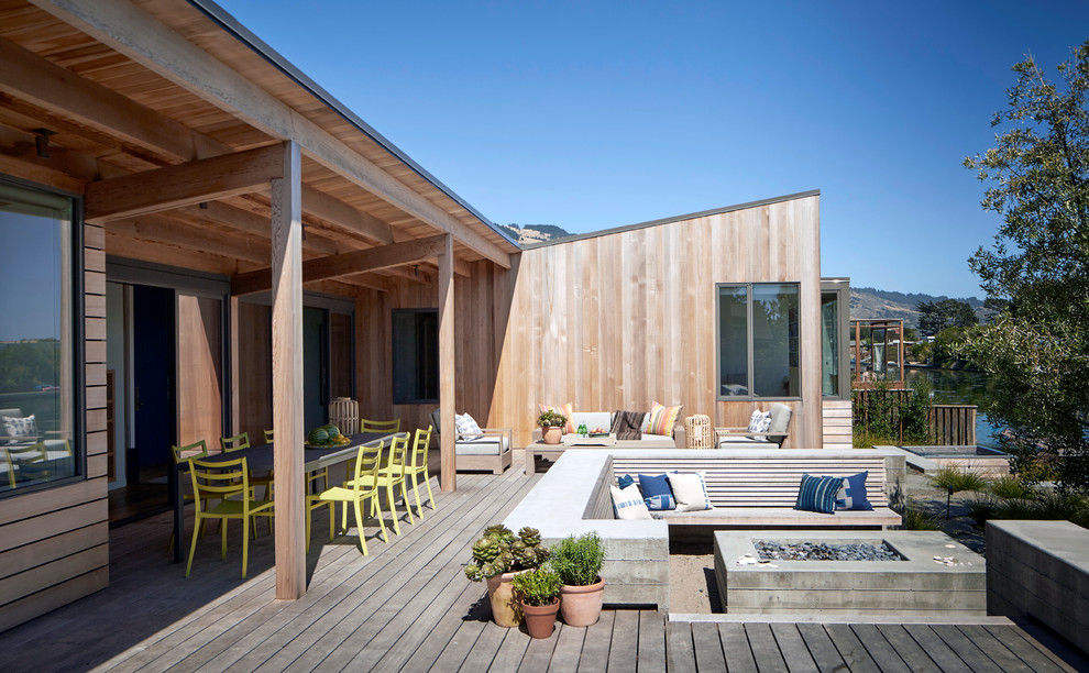 Design ideas for a contemporary backyard deck in San Francisco with a fire feature and no cover.