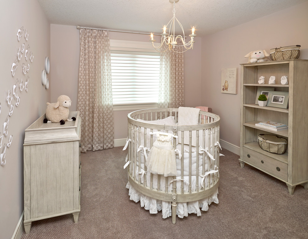 Design ideas for a small transitional nursery for girls in Edmonton with beige walls, carpet and grey floor.