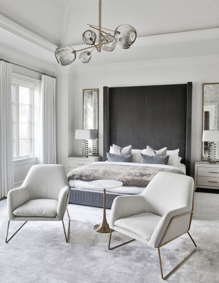 Inspiration for a contemporary bedroom in Toronto with white walls, carpet and grey floor.