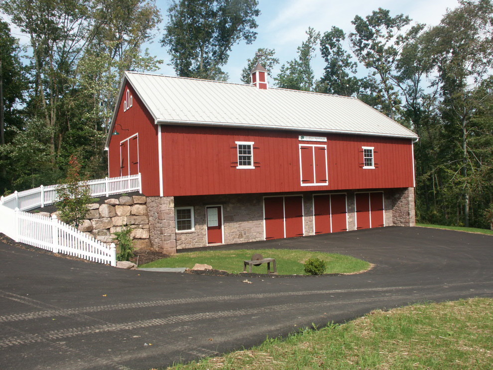This is an example of a mid-sized modern two-storey red exterior in Philadelphia with mixed siding and a gable roof.