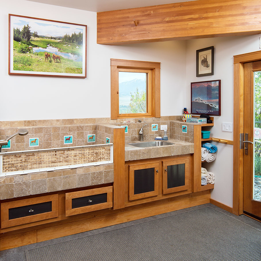 This is an example of a mid-sized contemporary mudroom in Other with white walls, linoleum floors, a single front door and a medium wood front door.