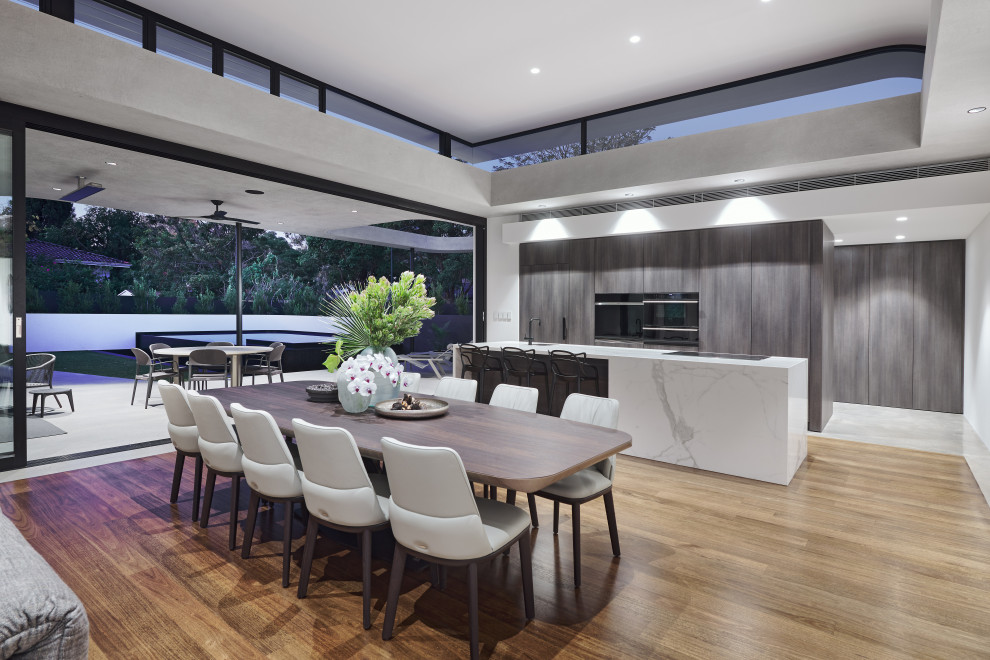 Inspiration for a large contemporary kitchen/dining combo in Perth with grey walls, light hardwood floors and beige floor.