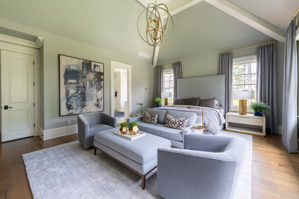 Inspiration for a large transitional master bedroom in Atlanta with grey walls, medium hardwood floors, brown floor and vaulted.