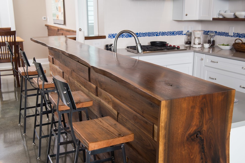 Photo of a kitchen in Atlanta with wood benchtops.