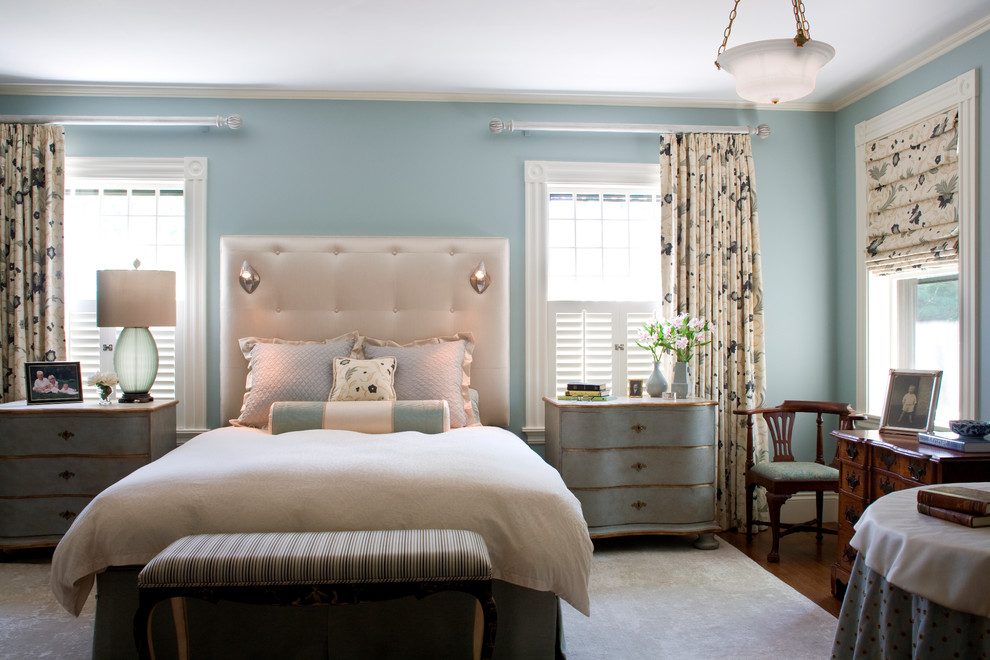 Photo of a traditional bedroom in Boston with blue walls.