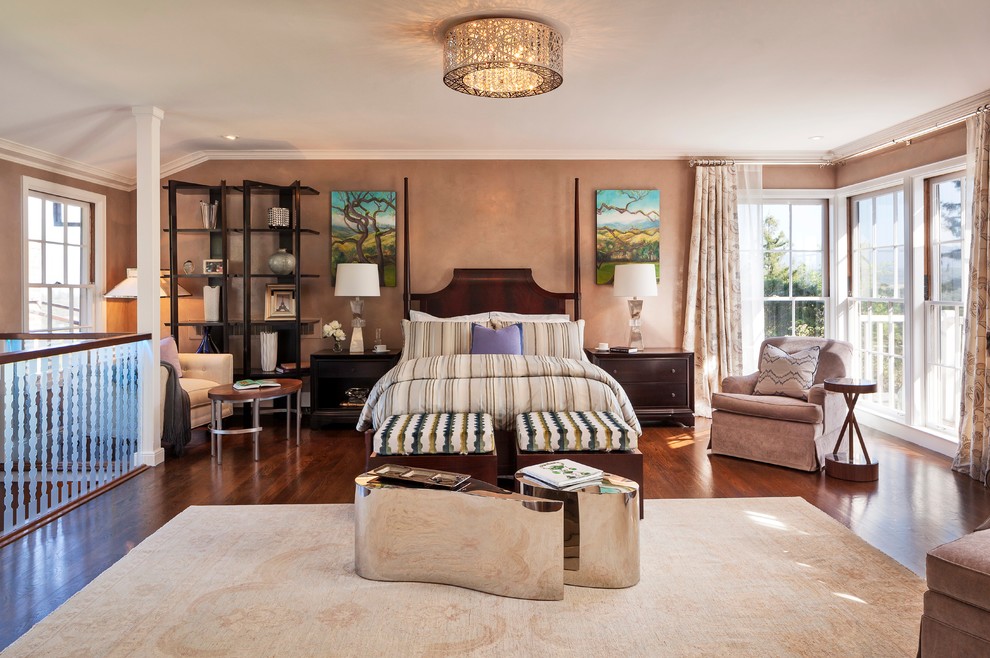 This is an example of a transitional master bedroom in San Francisco with beige walls and dark hardwood floors.